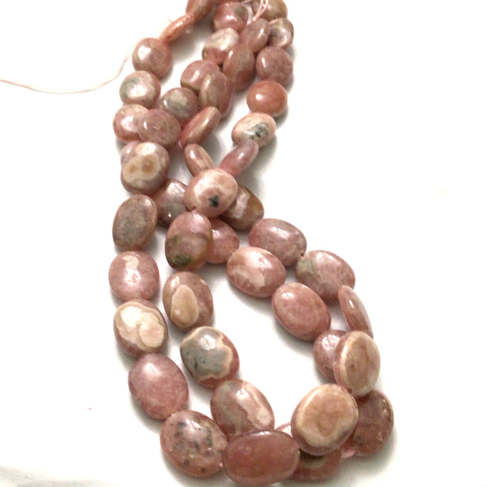10x14mm mm Rhodochrosite smooth ovals gemstone strand on a white background, front close up overview.