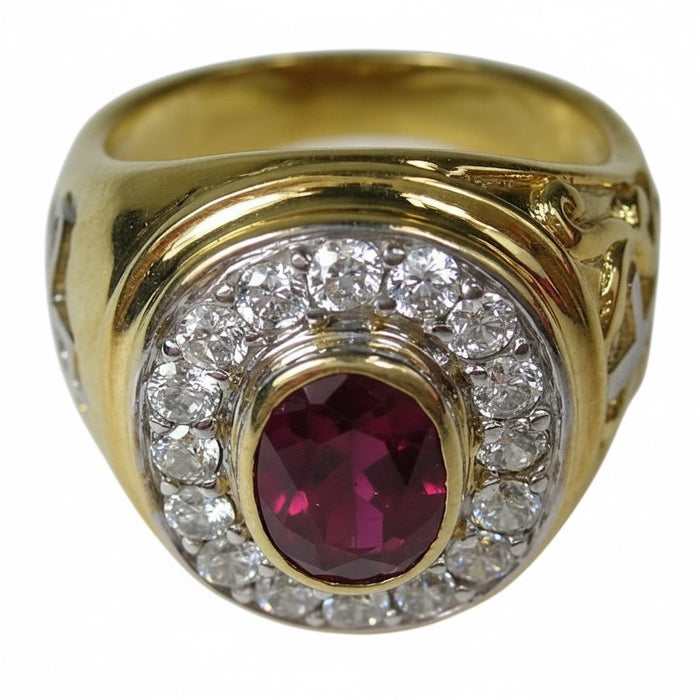 Top-down angle of the men's gold bishop ring showing the red ruby and surrounding design.
