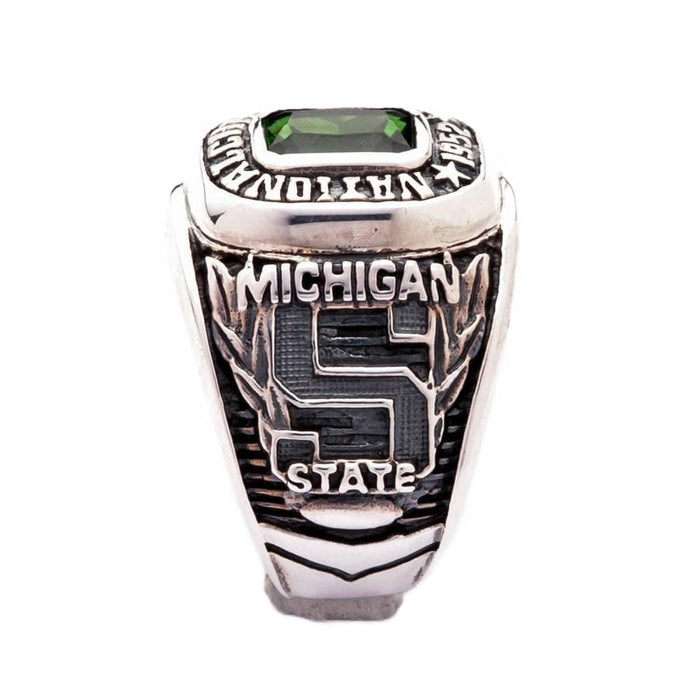 The side of the green stone championship ring showing the Michigan State "S" logo.