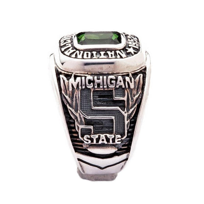 The side of the green stone championship ring showing the Michigan State "S" logo.