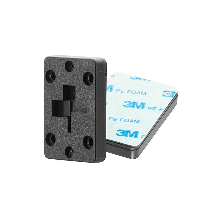 The 2-Way Single T-Slot Pattern to 4-Hole AMPS Adapter with Adhesive Plate includes two black plastic plates: one with a “3M PE FOAM” adhesive back and one 4-Hole AMPS mount, shown upright and flat to display features.