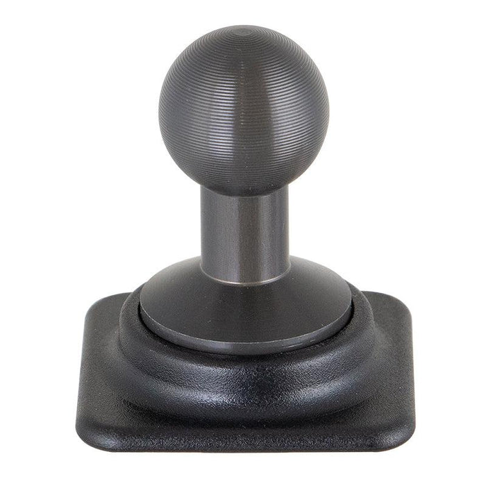 A close-up of a black coffee tamper with a textured handle and flat base, upright on a square black platform next to an Arkon HD Series 20mm Aluminum Ball to Dual T-Tab Adapter.