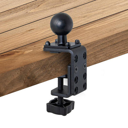 The 38mm (1.5 inch) Ball to Adjustable Clamp Adapter is mounted to a wooden board edge and secured with a star-shaped screw handle at the bottom.