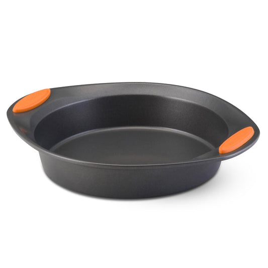 The 9-Inch Nonstick Round Cake Pan, made from heavy gauge steel and featuring orange silicone handles, guarantees effortless baking and is oven-safe.