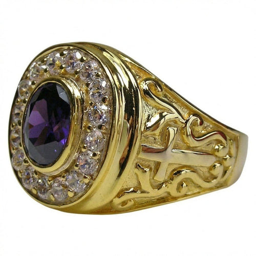 Angled view of a yellow gold bishop ring with an oval purple amethyst, clear stone halo, and side cross scrollwork.