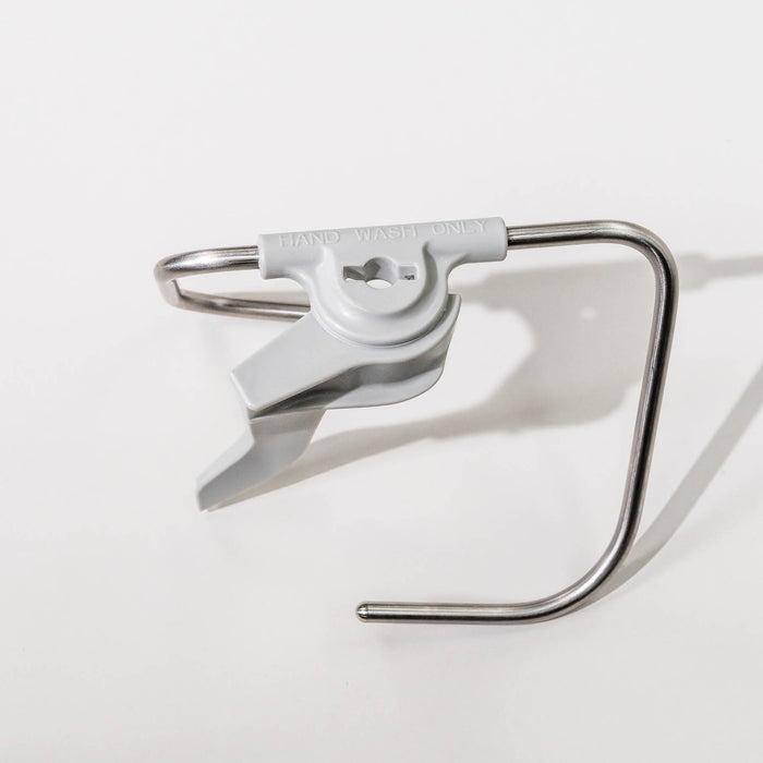 Top view of a NutriMill artiste dough hook on a grey background