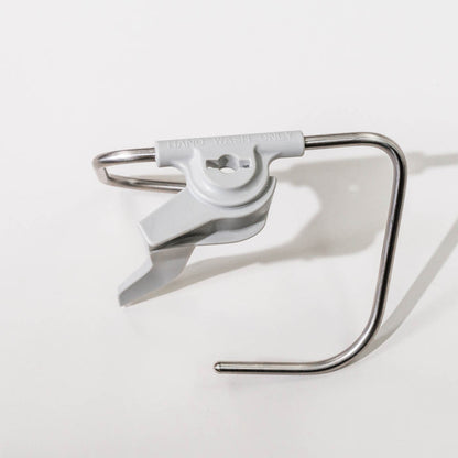 Top view of a NutriMill artiste dough hook on a grey background