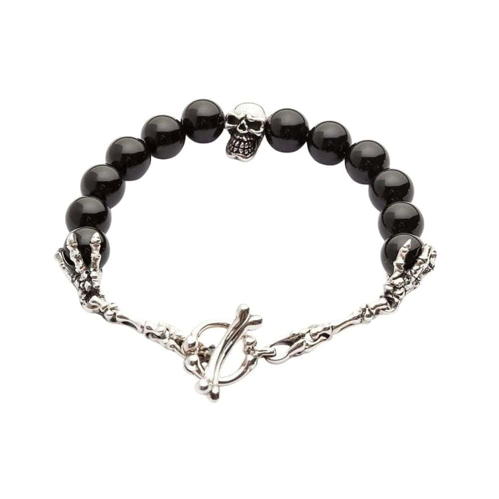 A full view of the men's black onyx skull bracelet, showing the sterling silver skull centerpiece and bone toggle clasp on a white background.