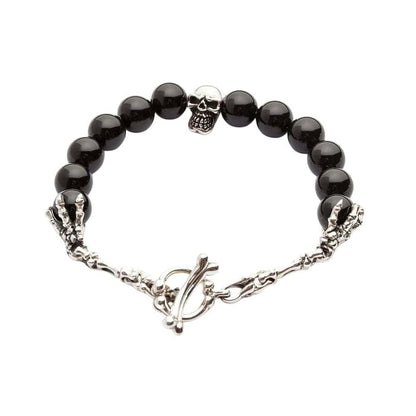 A full view of the men's black onyx skull bracelet, showing the sterling silver skull centerpiece and bone toggle clasp on a white background.