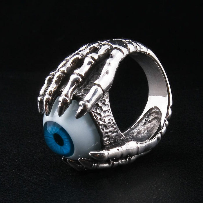 An angled view of the biker eyeball ring, highlighting the detailed texture and polished finish of the sterling silver claw setting.