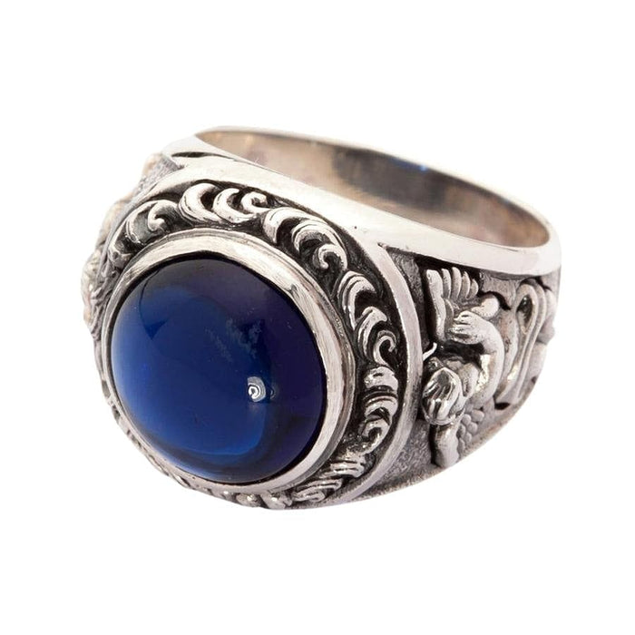 Side profile of silver ring showing intricate Cupid cherub carving