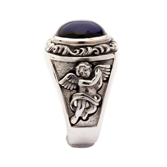 Side design view of handmade silver Cupid ring with blue stone