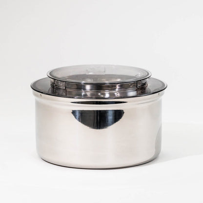 NutriMill bottom drive stainless steel bowl on a grey background