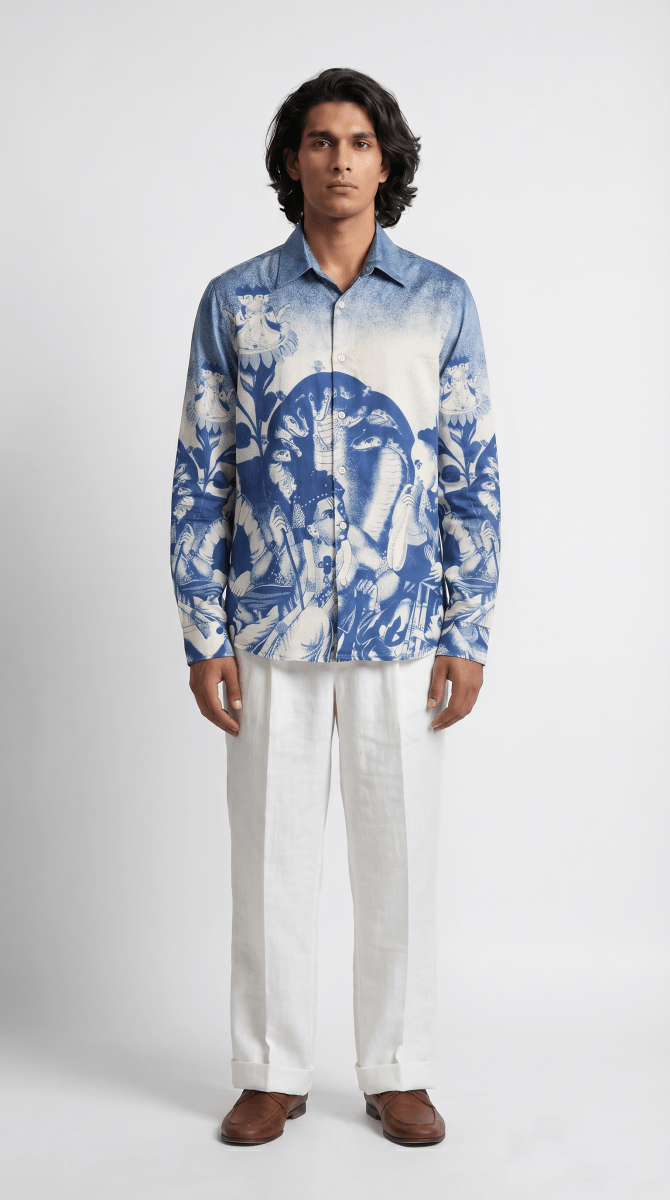 Man wearing the blue and white Brahma shirt with white trousers, full length front view