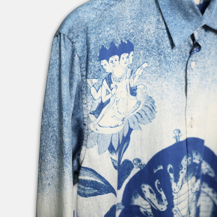 Close view of the Brahma shirt collar and shoulder showing the faded blue and white print