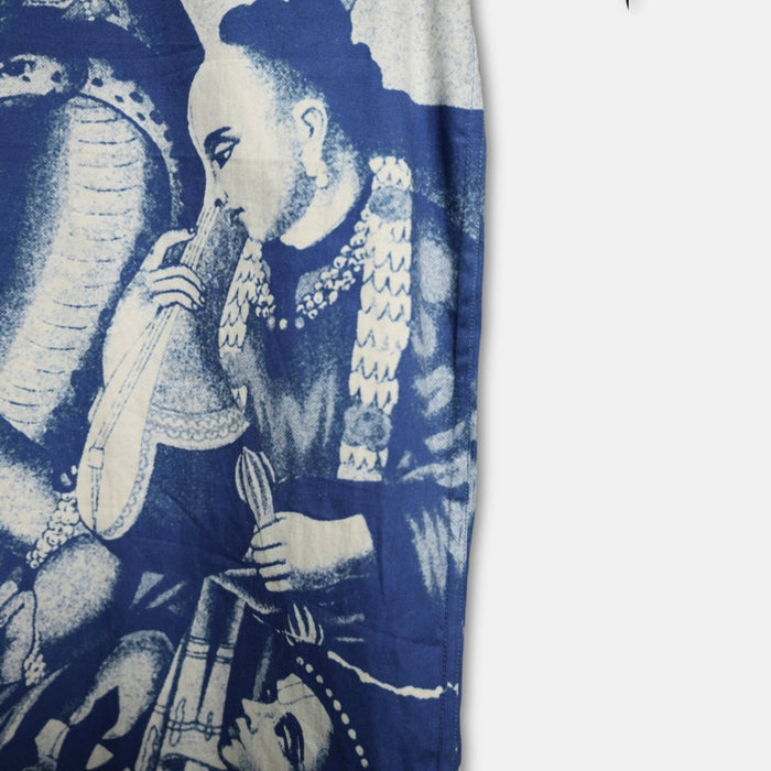 Close view of the blue and white print on the Brahma shirt sleeve and front