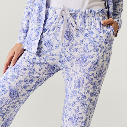 Blue and white floral pajama set on a plain background