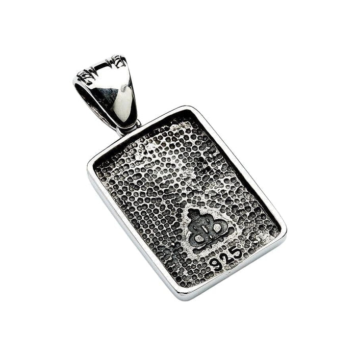Reverse side of the pendant displaying a stippled texture, crown logo, and 925 sterling silver stamp.
