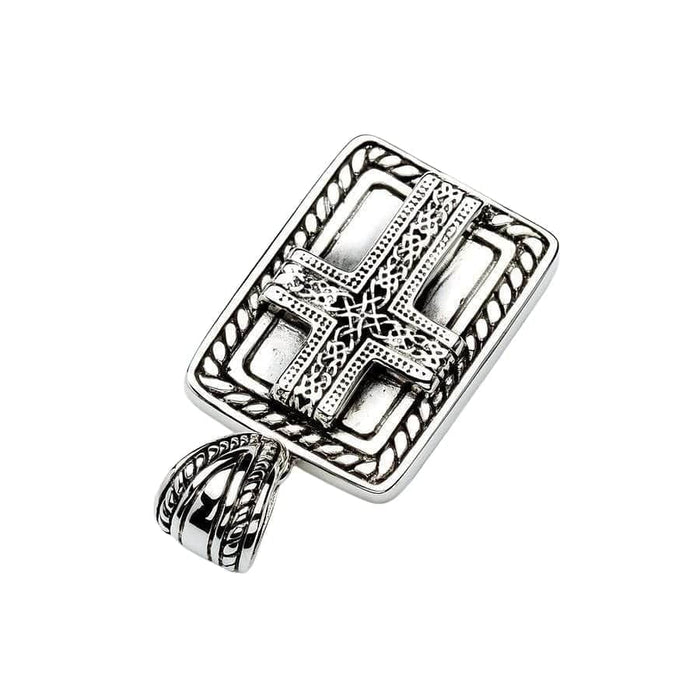 Diagonal flat lay of the oxidized silver dog tag pendant highlighting the raised Celtic cross and interlocking knotwork.