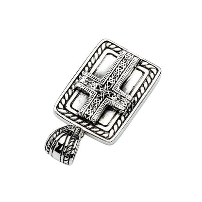 Diagonal flat lay of the oxidized silver dog tag pendant highlighting the raised Celtic cross and interlocking knotwork.