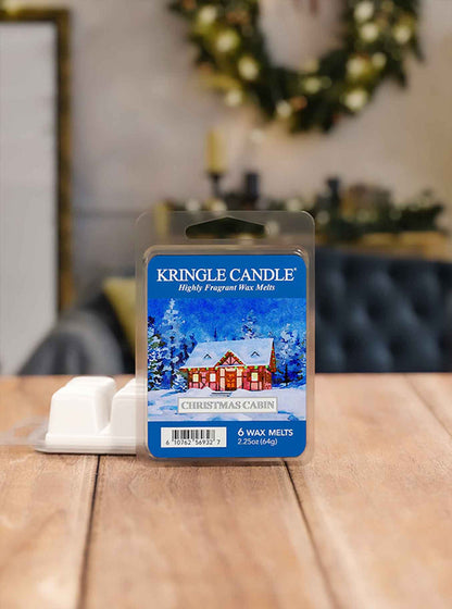 Kringle Candle wax melt package on a wooden surface with a festive background