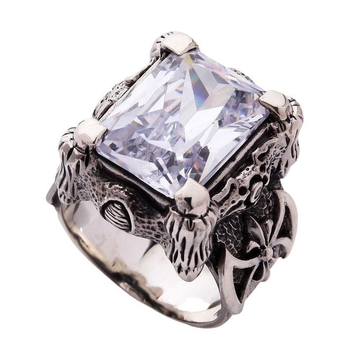 The handcrafted dragon claw setting of the sterling silver ring, isolated on a white background to show detail.
