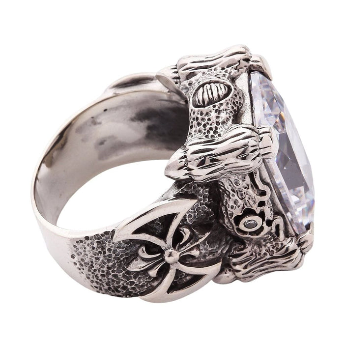 A top-down view of the clear dragon ring, highlighting the impressive size and facets of the emerald-cut stone.