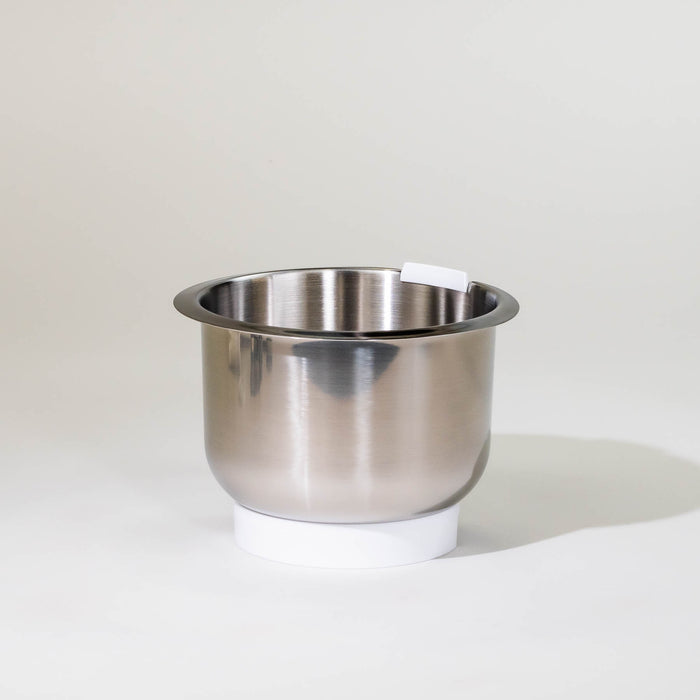 Bosch compact mixer stainless steel bowl with white plastic base on a grey background