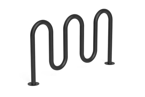 Contemporary Loop Bicycle Rack with five black tubular steel loops in a wave pattern, surface mounted on concrete near stone pillars and greenery