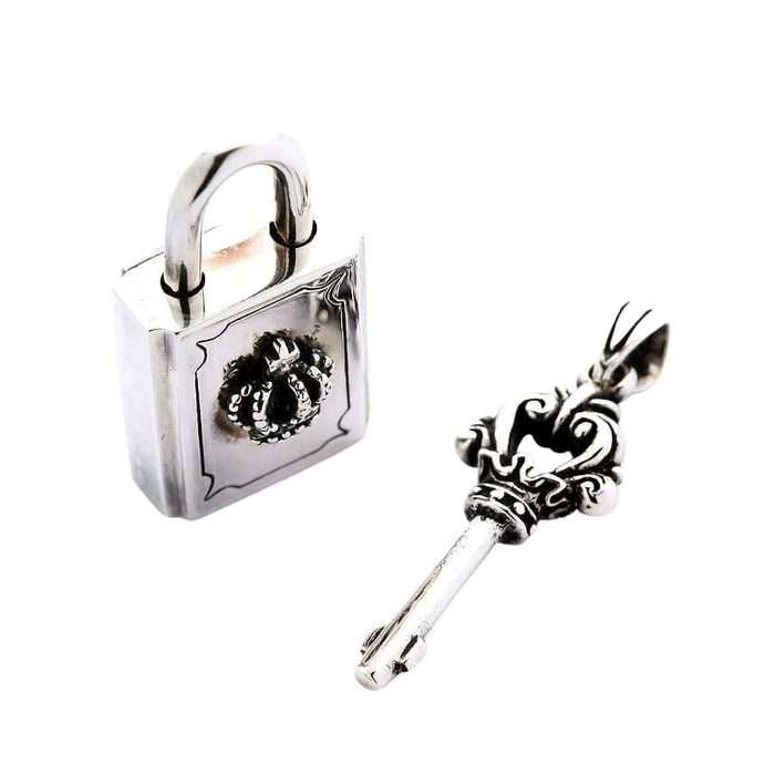 A set of sterling silver pendants featuring a functional crown padlock and an ornate key.