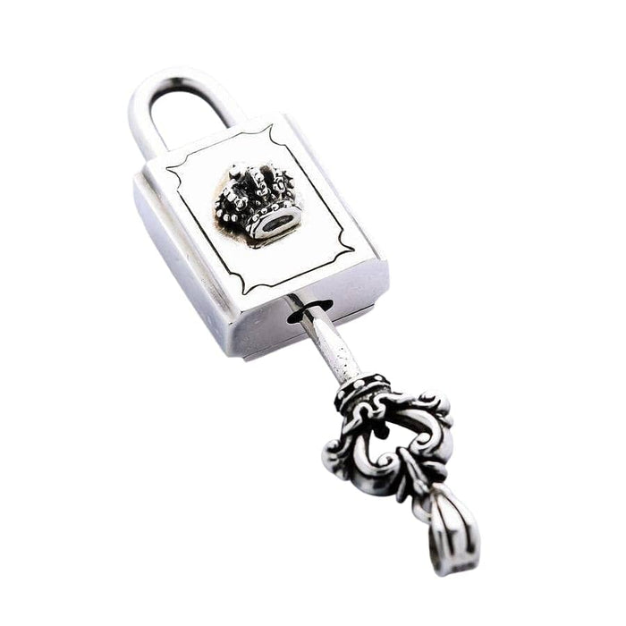 The gothic-style silver key inserted into the crown padlock pendant