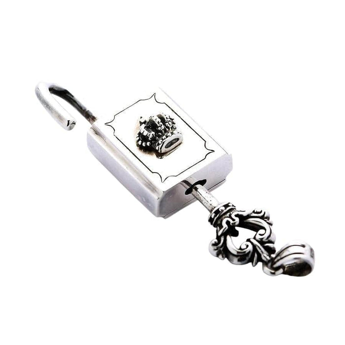 The sterling silver crown padlock pendant shown unlocked with its matching ornate key.