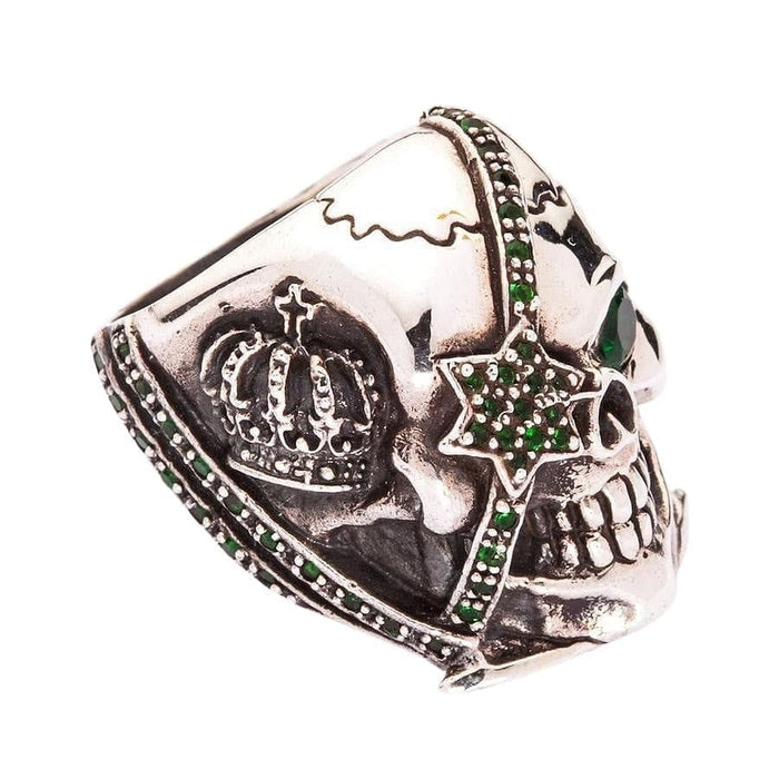 Side view focusing on the star patch strap detail and green stones on the heavy silver ring.