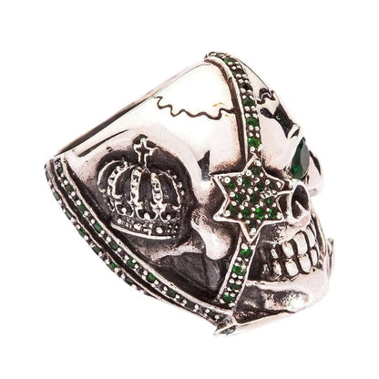 Side view focusing on the star patch strap detail and green stones on the heavy silver ring.