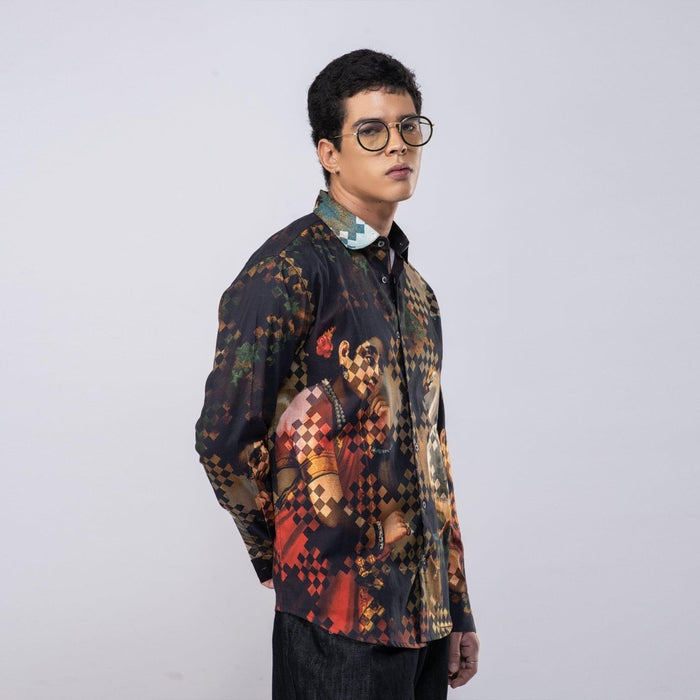 Man wearing the black Damayanti's Secret shirt, side view, showing the woman and swan print on the front
