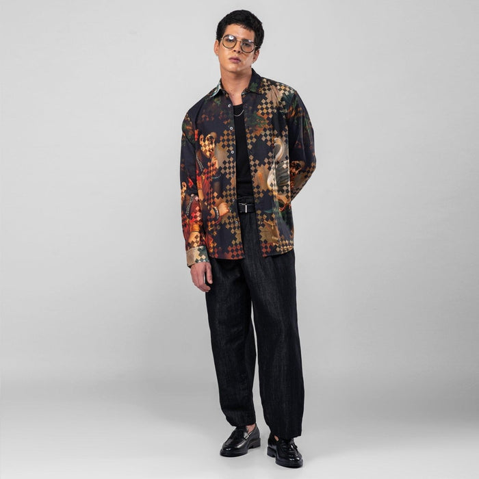 Man wearing the Damayanti's Secret shirt with black trousers, full length three-quarter view, hand at his side