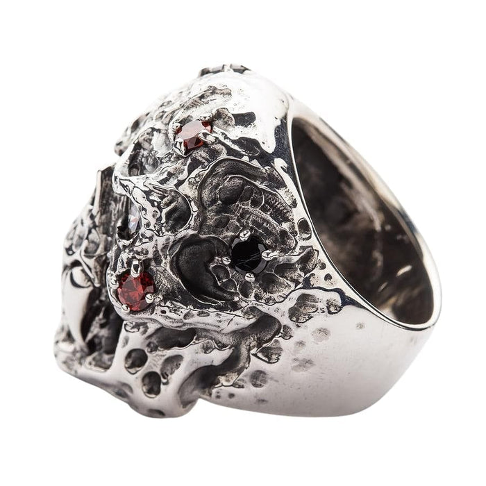 A side view of the textured undead skull ring, showing the intricate, corroded details and stone settings.