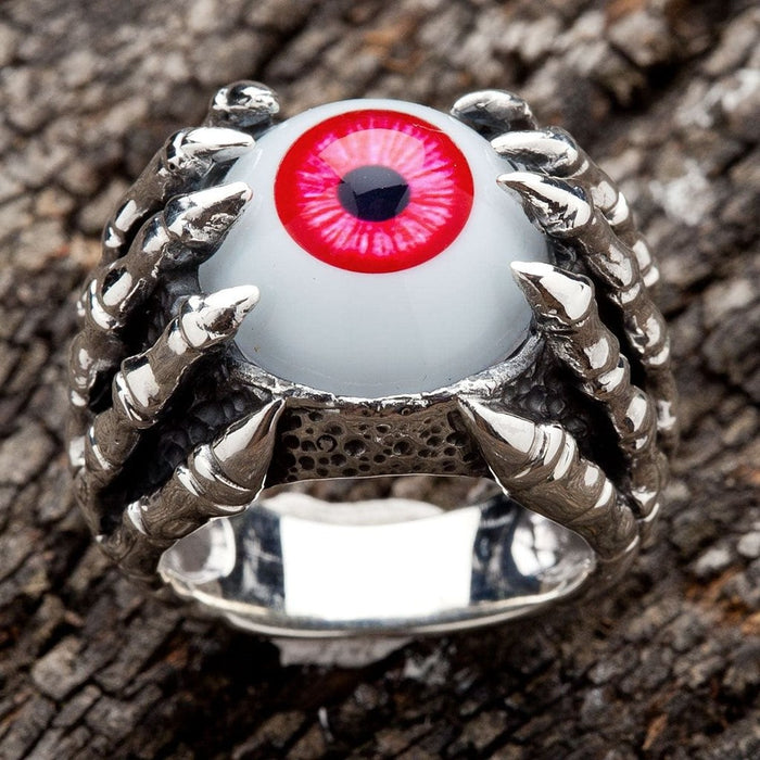 Front view of 925 sterling silver gothic ring with red eyeball gripped by dragon claws