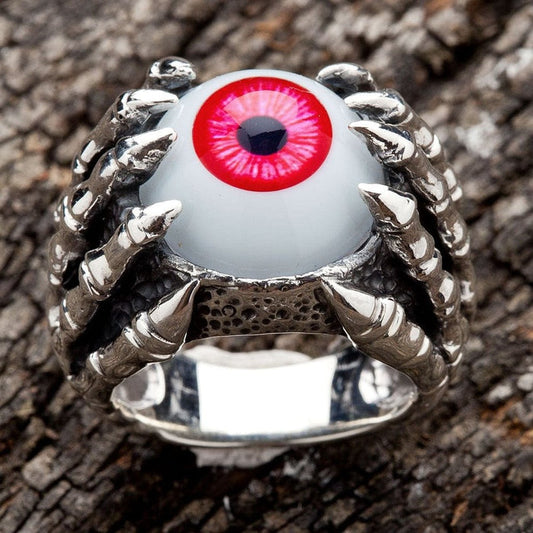 Front view of 925 sterling silver gothic ring with red eyeball gripped by dragon claws