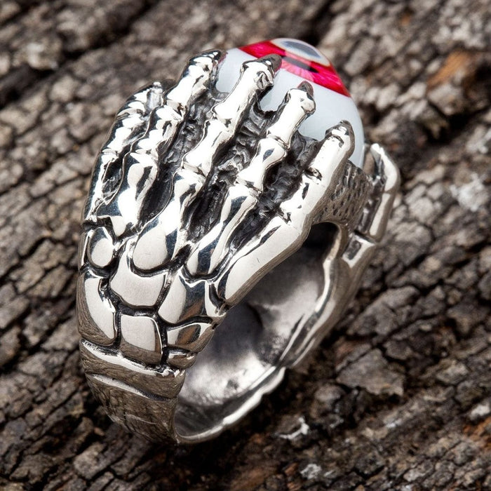 Close-up detail of scaled dragon claws on sterling silver gothic eyeball ring