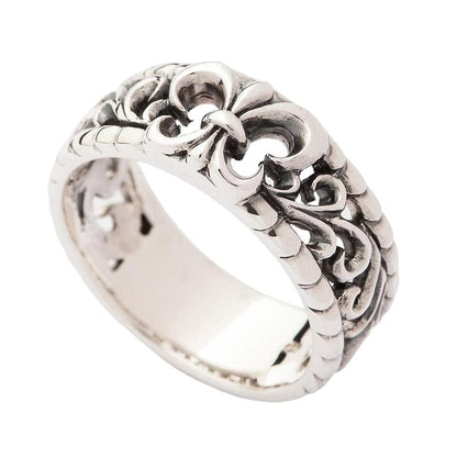 Side view of the openwork silver band ring displaying the continuous pattern.