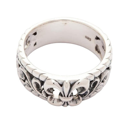 Top-down view looking through the silver band ring, showing the ring's thickness and interior hallmark.