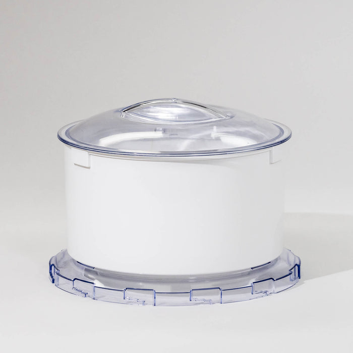 A white flour sifter attachment for a stand mixer with a clear lid.