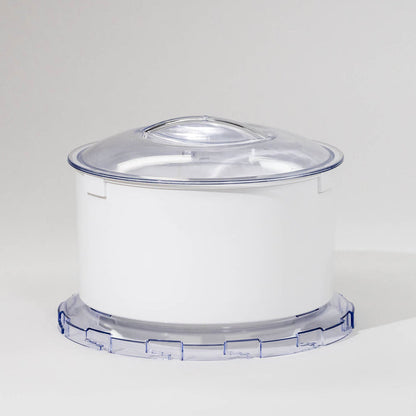 A white flour sifter attachment for a stand mixer with a clear lid.