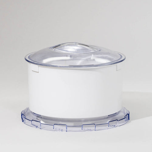 A white flour sifter attachment for a stand mixer with a clear lid.