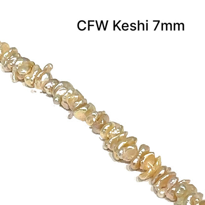 One peach 7mm Fresh Water Keishi Pearl 15'' strand (centered drilled)