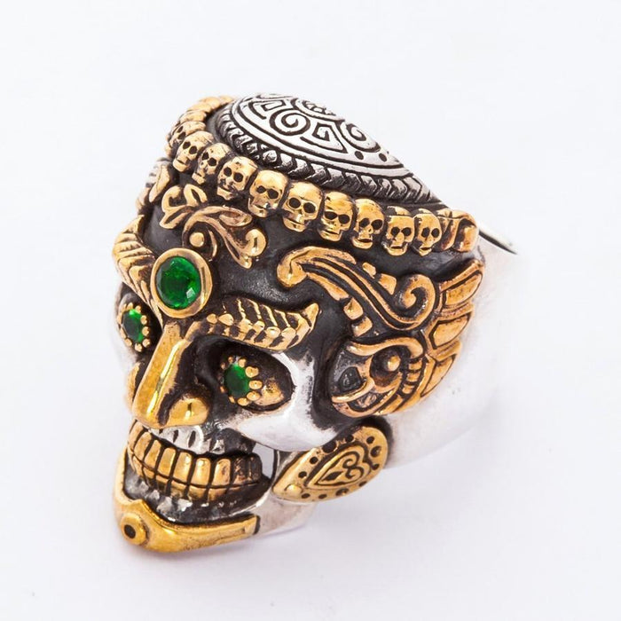 Detailed side angle highlighting the gold-tone crown of five skulls and intricate Vajrayana Buddhist iconography.
