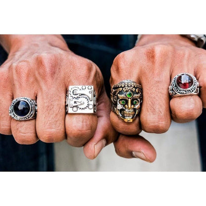 A man's hand wearing the large Tibetan skull ring, demonstrating its impressive and bold size.