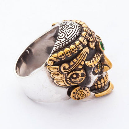 Profile view emphasizing the smooth sterling silver band, gold-tone side details, and carved mandala pattern on the cranium.
