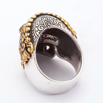 Rear angle revealing the thick sterling silver band's interior engraving and the back of the carved mandala cranium.